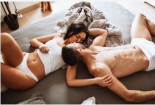 Adult couple relaxing together in a calm bedroom setting